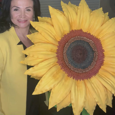 Woman holding a Giant Sunflower
