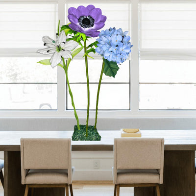 Restful Comfort Tall Table Centerpiece – White Lily, Blue Hydrangea, and Purple Anemone, 12" and 18" Diameter Flowers