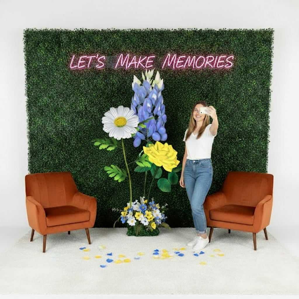 Wide view of photo booth wall flower display showing full step and repeat pattern for event photography